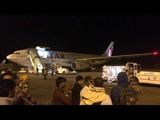 Woman arrested after attempt to open flight's exit door