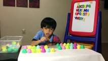 Learning ABC by matching surprise eggs with fridge letter magnets-KvLqAuuN