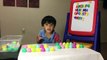 Learning ABC by matching surprise eggs with fridge letter magnets-KvLqAuuNy