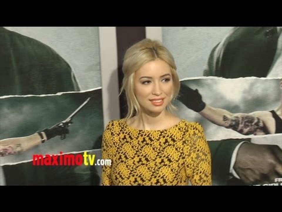 Christian Serratos at "Alex Cross" Premiere Black Carpet Arrivals