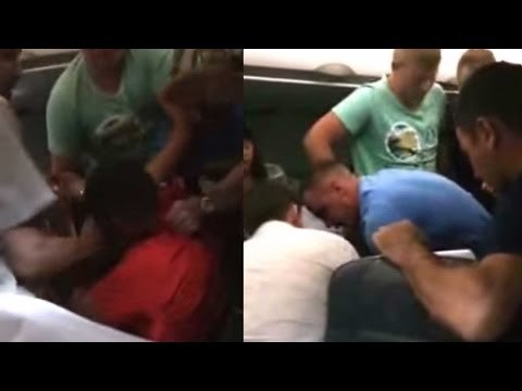 Drunk Passenger tied up with seatbelts in Siberia Airlines plane