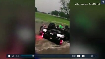 Incredible rescuse of baby from capsizes truck captured on video