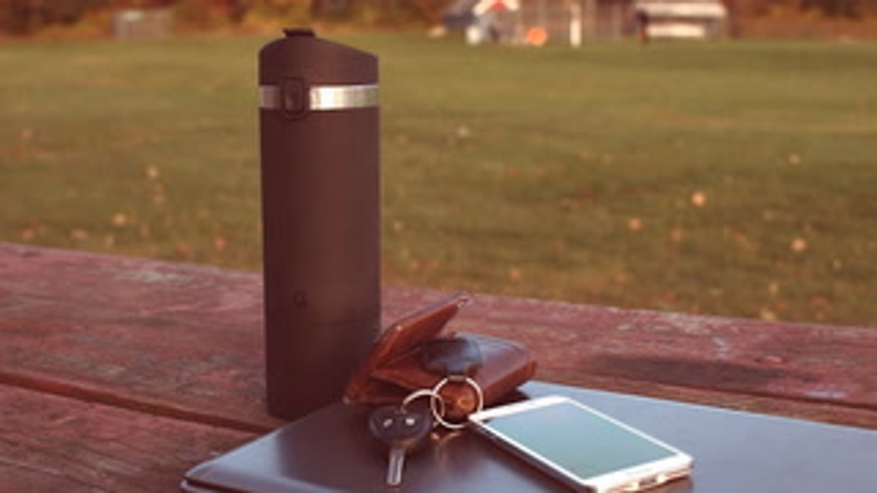 This mug brews a cup of coffee while on the go