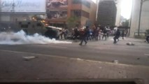 Armoured vehicle runs over protesters in Venezuela street battle