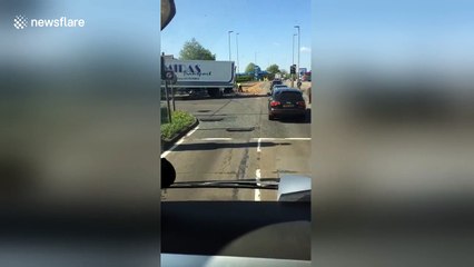Thousands of potatoes spill out of lorry in Cheshire, UK