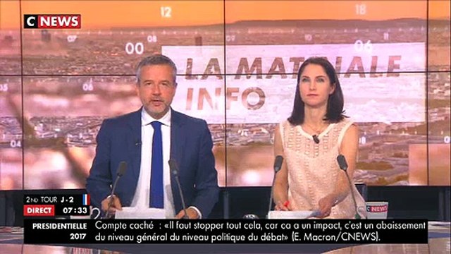 En plein état d'urgence, Greenpeace sur la Tour Eiffel depuis 7h ce matin pour déployer une banderole anti-FN