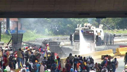 Venezuelans clash with security forces during mass protest