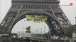 Contre le FN, Greenpeace affiche une banderole... sur la tour Eiffel