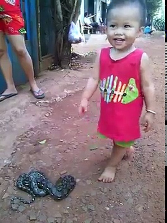 Baby Playing With Snake
