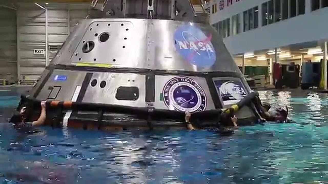 Splish splash this isn’t a bath. Divers practice recovering the Orion space