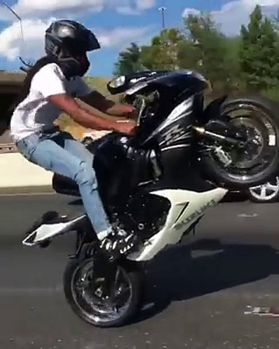 Heavy Bike One Wheeling By A Girl