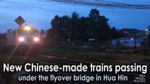 New Chinese-made trains passing under the flyover bridge in Hua Hin