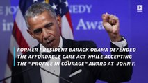 Obama defends Affordable Care Act during awards ceremony