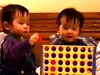 18 month old twins make funy faces and laugh