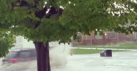 Garbage Can Floats Down Flooded Denver Street