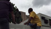 Opposition Leaders Attempt to Climb Police Barrier in Caracas