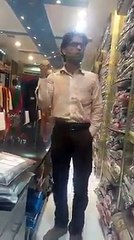 Hidden talent salesman saling cloths by mimicing various artists