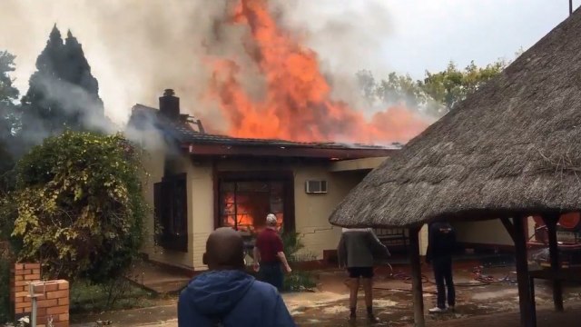 South Africa protests turn violent as white farmers accused of killing black teen are bailed