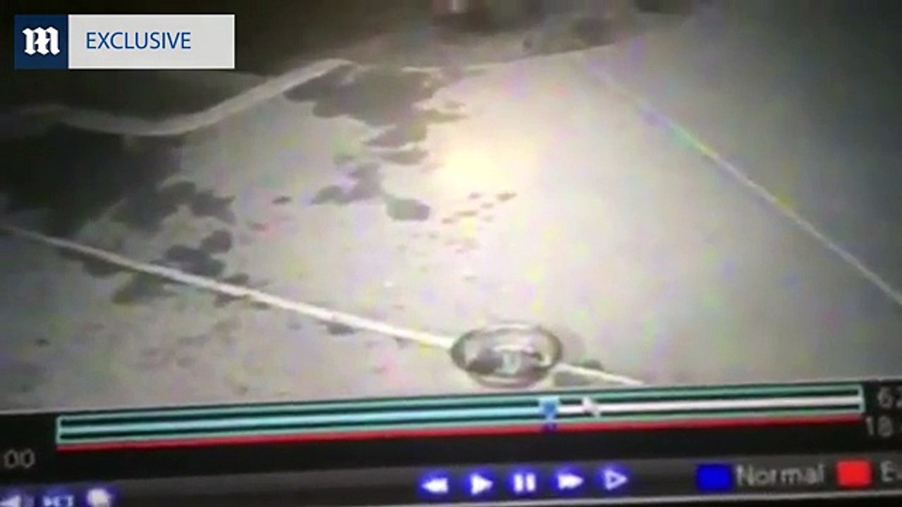 Handcuffed Adrien jones eats food from ground yard