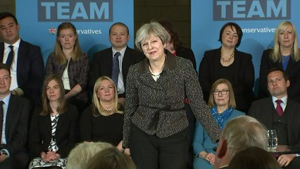 May defends energy prices cap