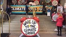 Activists Sound 'Climate Alarm' Inside Trump Hotel to Kick Off Protest