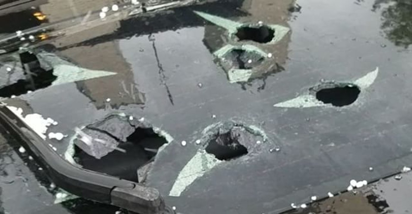 Hailstones Smash Windshield During Denver Storm