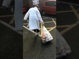 Trash Bag Bursts the Moment Woman Goes to Throw It in Garbage