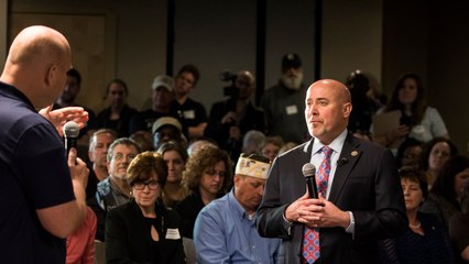 GOP lawmaker faces angry crowd at town hall