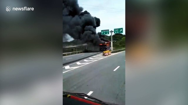 Coach gutted by blaze on Chinese motorway
