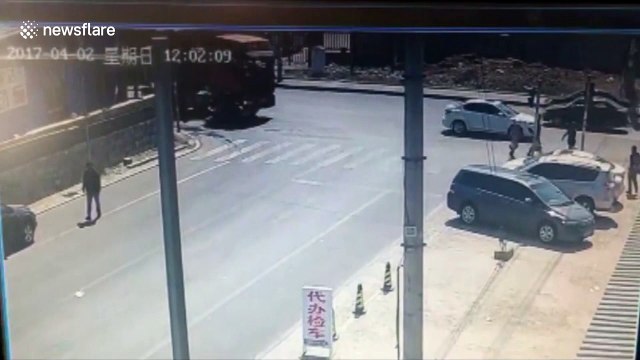 Scooter driver narrowly escapes being run over by lorry