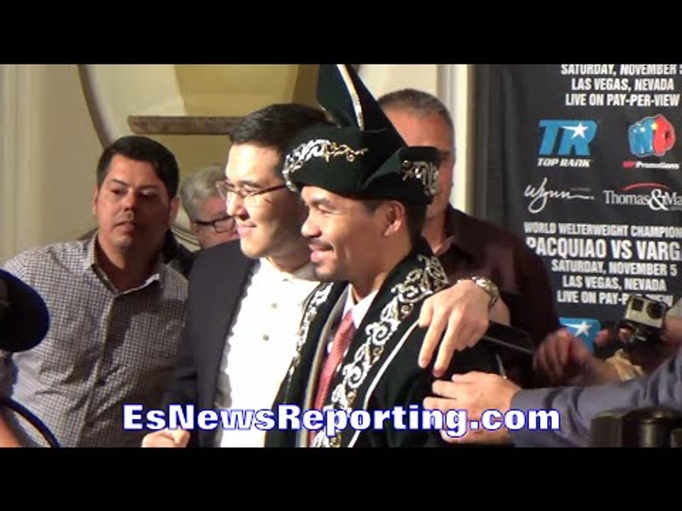 MANNY PACQUIAO MAKES DAY OF KAZAKHSTANIAN FAN; POSES IN TRADITIONAL SHAPAN ROBE GIFT FOR SELFIE