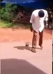 Drunken master trying to wear his chappal