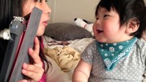 9 month old cute happy Japanese laughing baby.