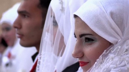30 couples celebrate simultaneous wedding in Aleppo