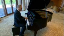 Putin plays piano during break at Silk Road summit