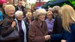 May confronted by angry voter over disability benefit cuts