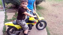 Little kid runs staight into fence with dirt bike