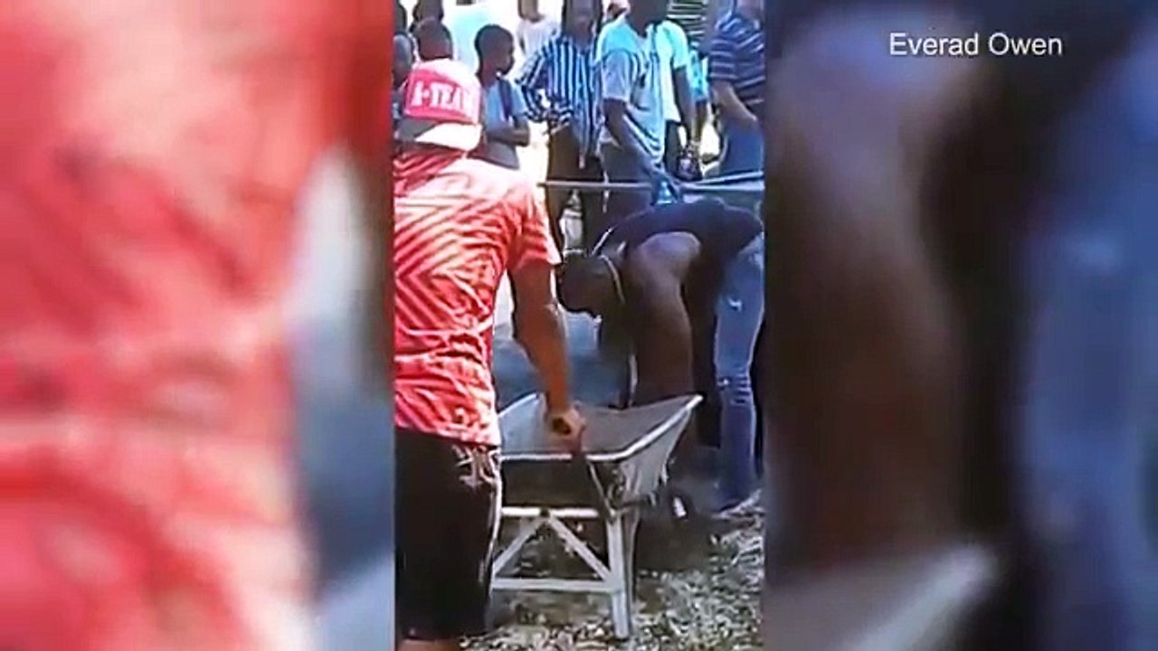 Usain Bolt Helps Dig Grave for Team Jamaica's Germaine Mason