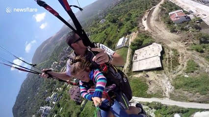Girl, 4, goes paragliding with her dad