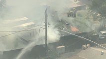 Firefighters battle large house fire in Tempe