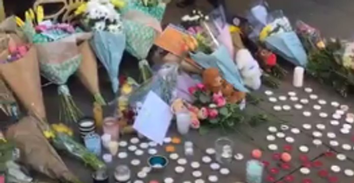 Bouquets and Candles Line Albert Square for Manchester Attack Victims