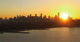 Sun Rises and Sets Over Melbourne Skyline in Timelapse