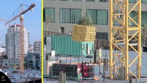 Tower cranes at work  Dual-camera shots of construction tower cranes in action at 4X (Week 59 set 2)
