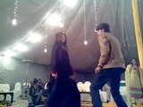 Pakistani girl and boy dance on wedding ceremony
