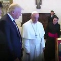 Donald J. Trump and Pope Francis exchange gifts at the Vatican. The Pope's present for the president A letter on climate
