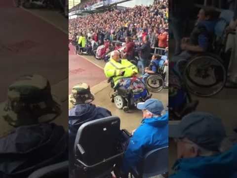 Soccer Fan in Motorized Wheelchair Celebrates Goal