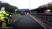 Horrifying moment police motorbike swerves across three lanes of motorway traffic and misses shocked driver by inches