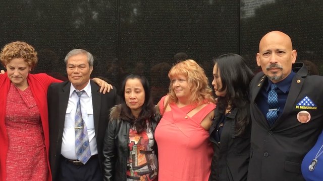 Children of fallen U.S. and North Vietnamese soldiers come together at Vietnam Memorial