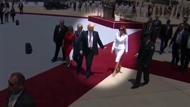 Donald Trump finally holds Melania's hand as he arrives for G7 summit
