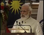Narendra Modi in new Look ith PM of Malesia in a Joint press conference   latest
